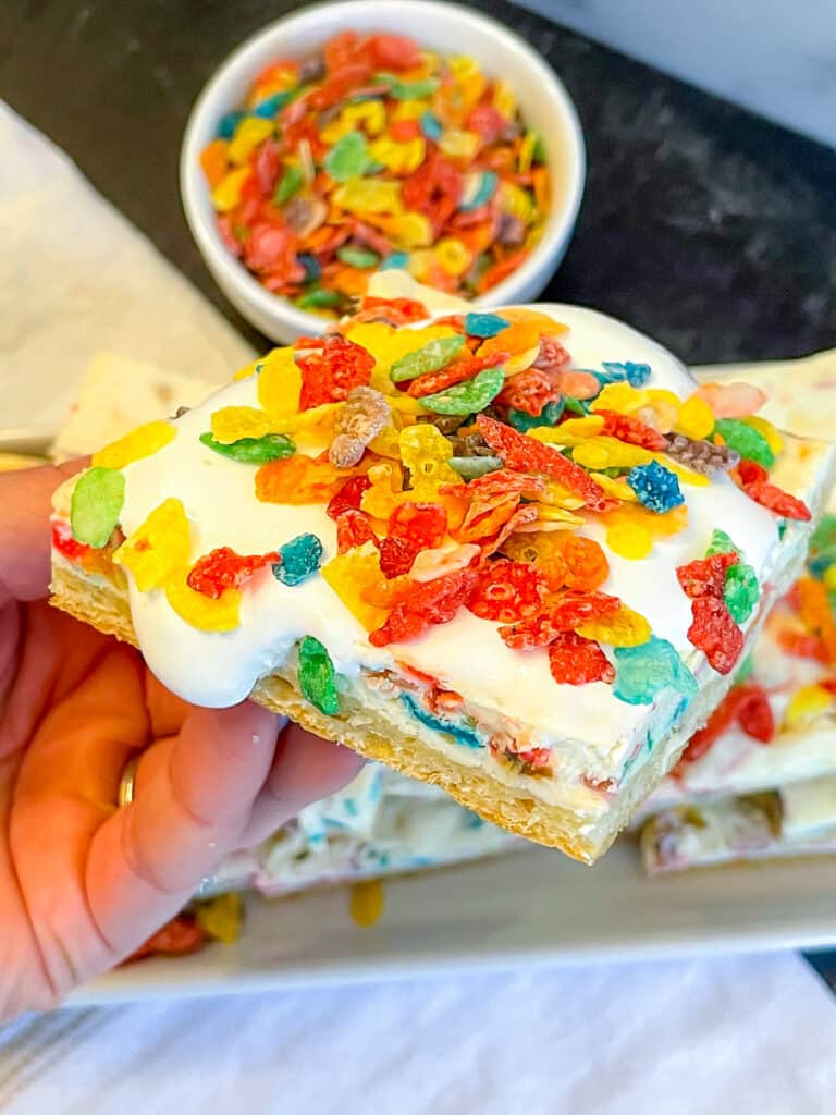 Cheesecake bar topped with Fruity Pebbles cereal