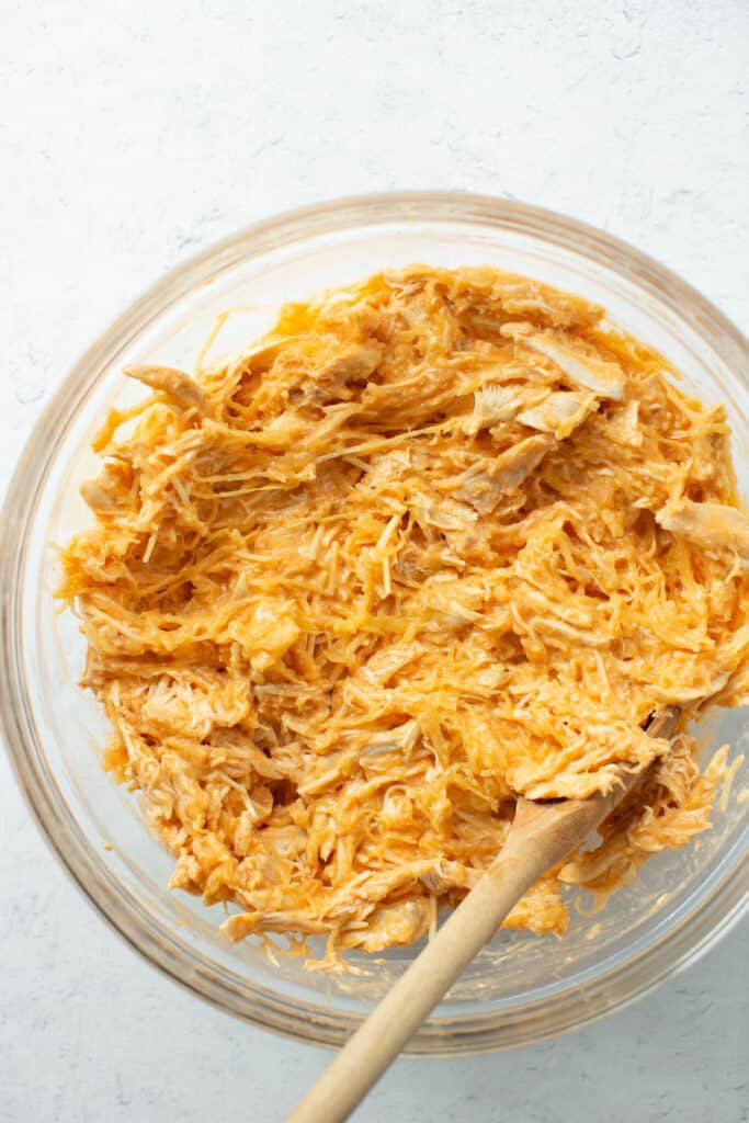 Buffalo chicken and spaghetti squash mixed in a bowl