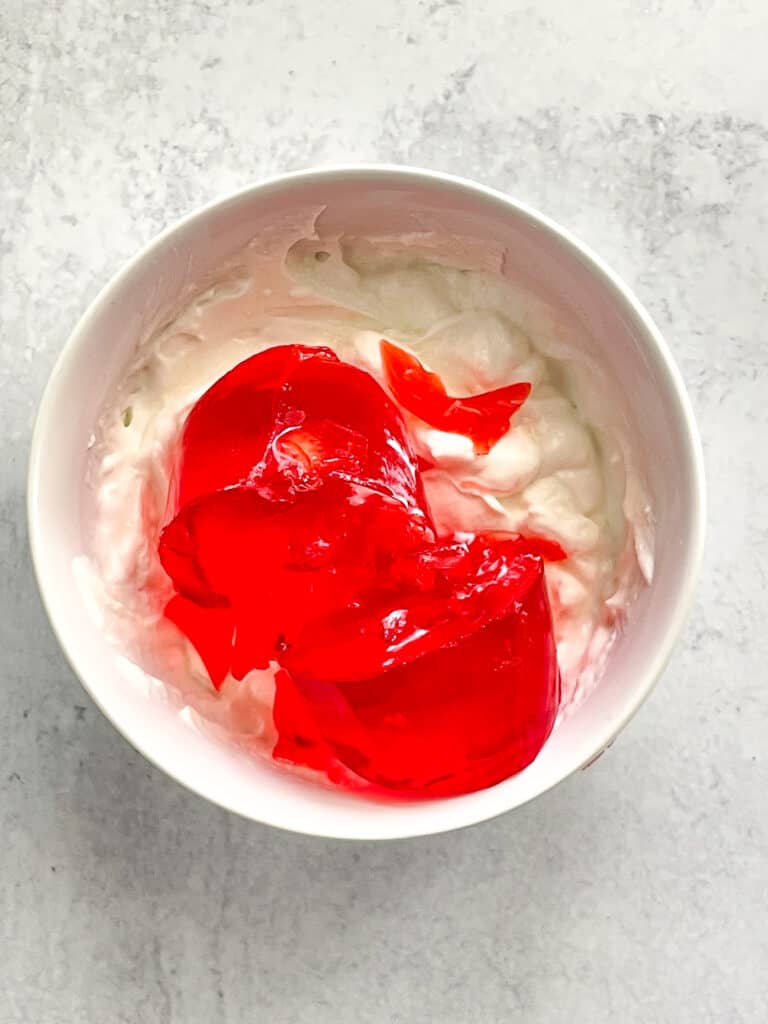 Yogurt and strawberry gelatin in a bowl