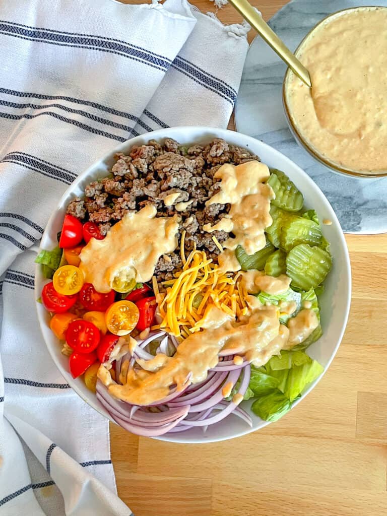Cheeseburger salad topped with skinny special sauce.