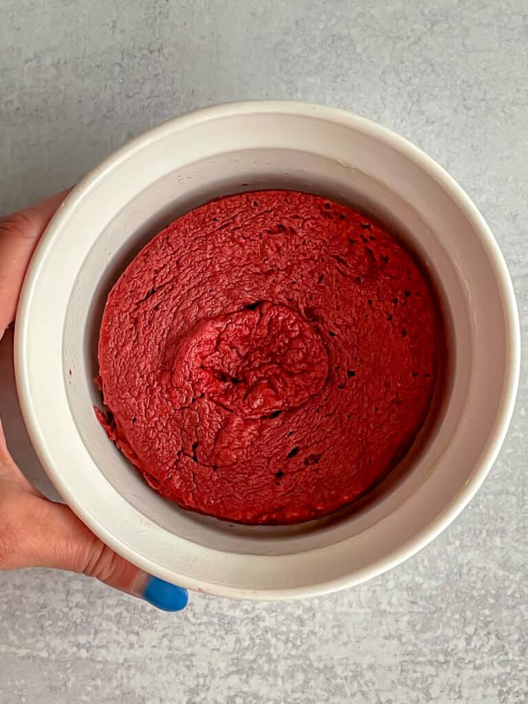 Red velvet mug cake in a small bowl without frosting.
