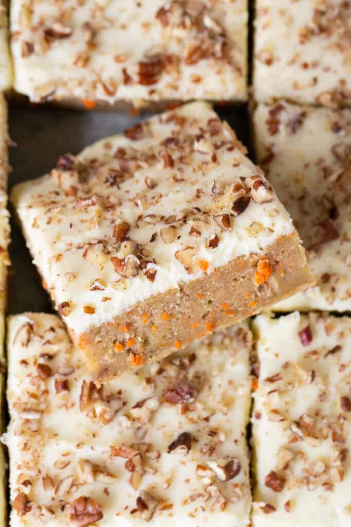 Zoomed in view of healthy carrot cake blondies cut into bars.