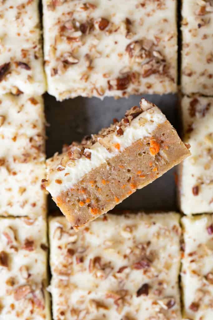 Zoomed in view of healthy carrot cake blondies cut into bars.