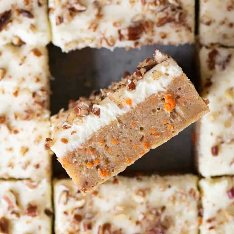 Zoomed in view of healthy carrot cake blondies cut into bars.