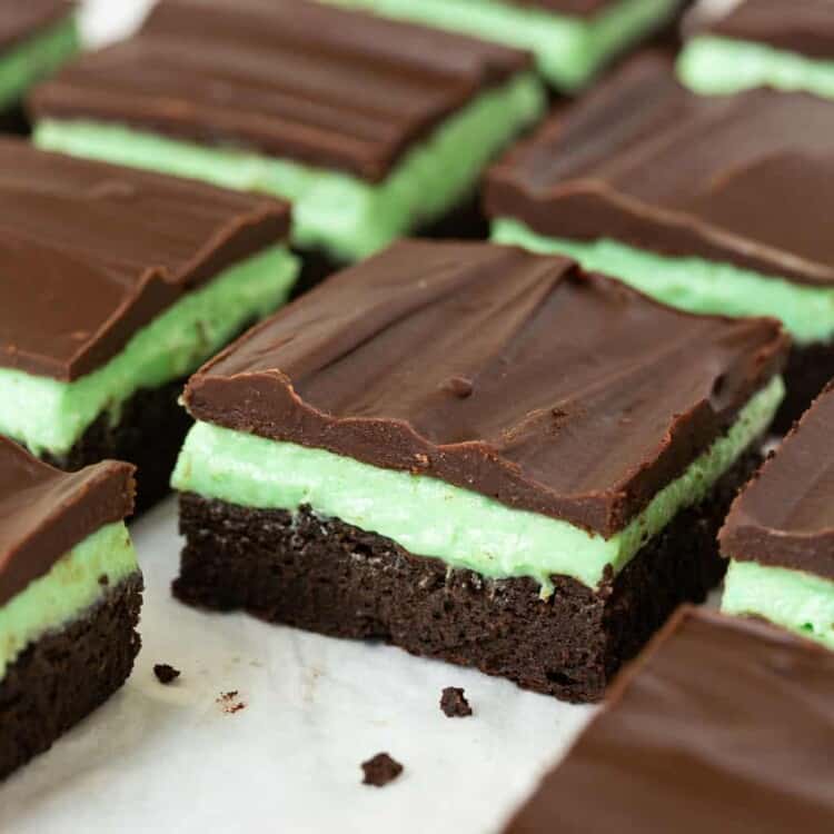 Chocolate mint brownies on parchment paper.