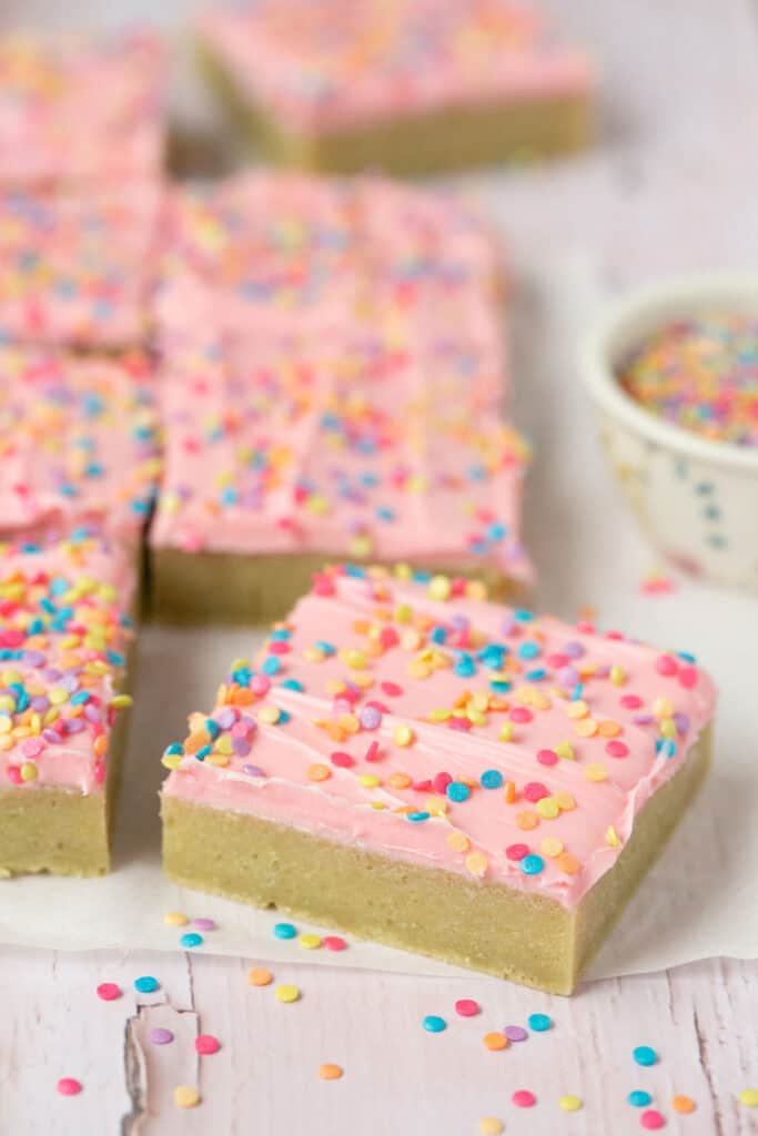 Sugar cookie bars on parchment paper.