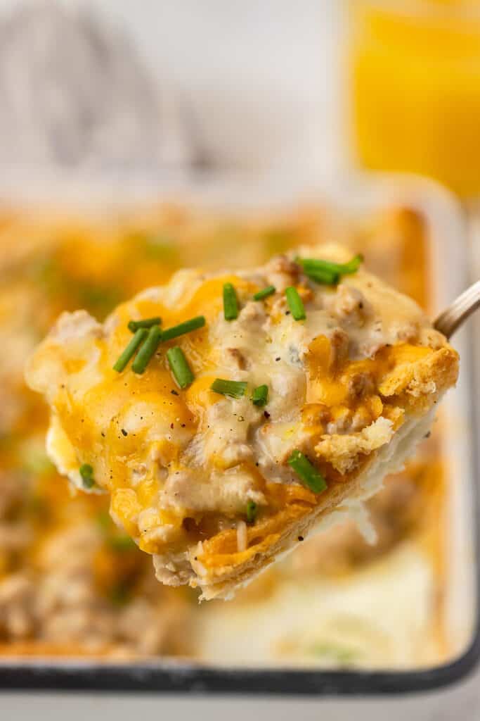 Zoomed in view of sausage and gravy breakfast casserole on a spoon.