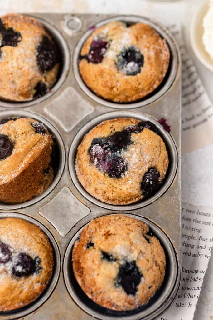 Skinny blueberry muffins in a muffin pan.