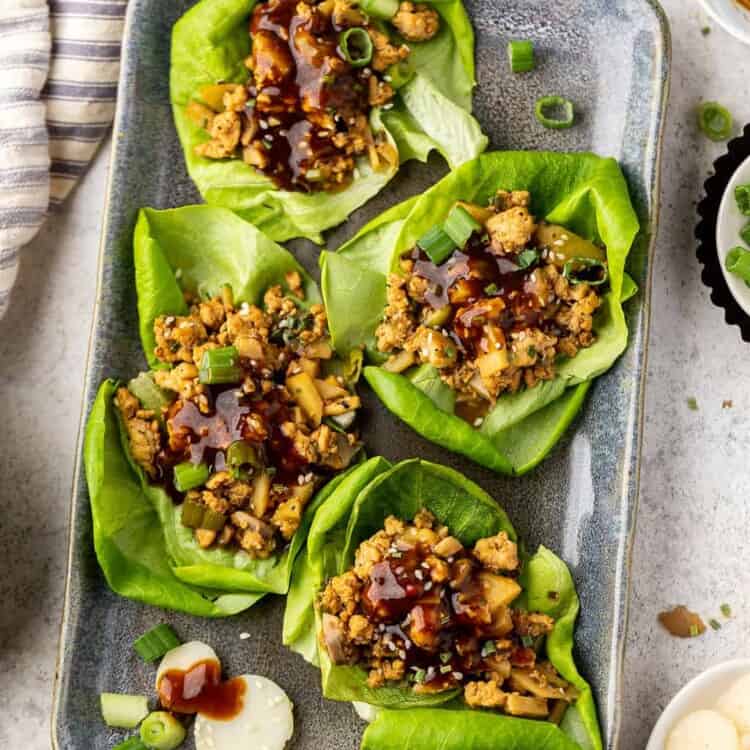 Chicken lettuce wraps on a tray.
