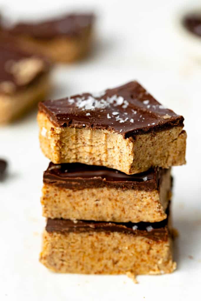 Three chocolate cookie dough squares stacked on top of each other.