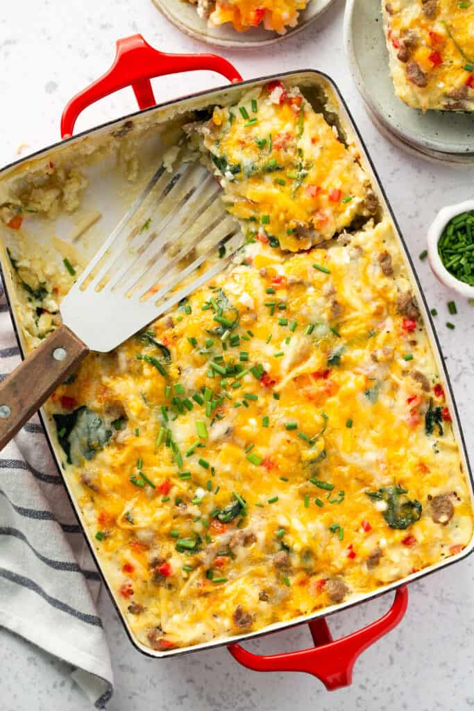 Cheesy southwest hashbrown casserole in a baking dish.
