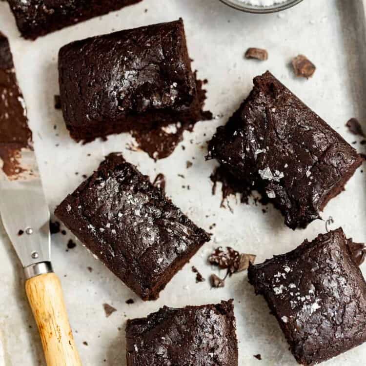 Small batch chocolate brownies on a tray with parchment paper.