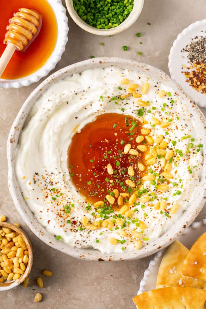 Whipped feta with honey in a bowl.