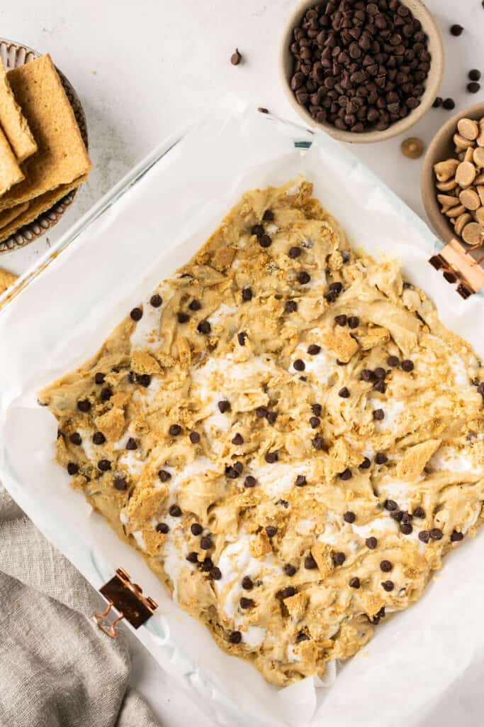 S'mores blondie batter in a square baking dish.