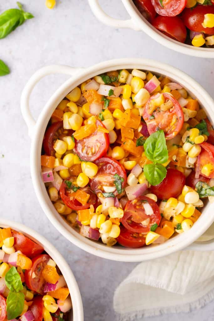 Rainbow corn salad in small bowls.