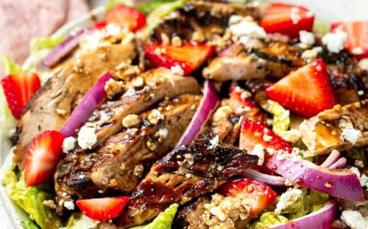 Balsamic grilled chicken salad on a plate.