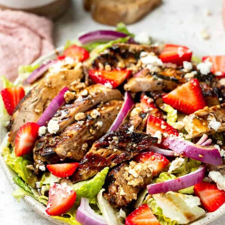 Balsamic grilled chicken salad on a plate.