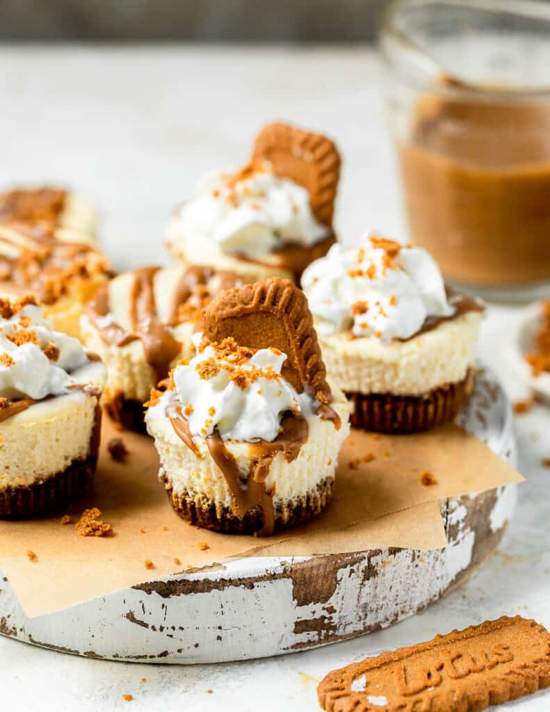 Mini biscoff cheesecakes on a tray.