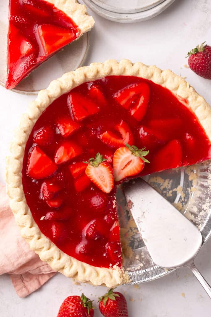 Strawberry pie with jello  being served.
