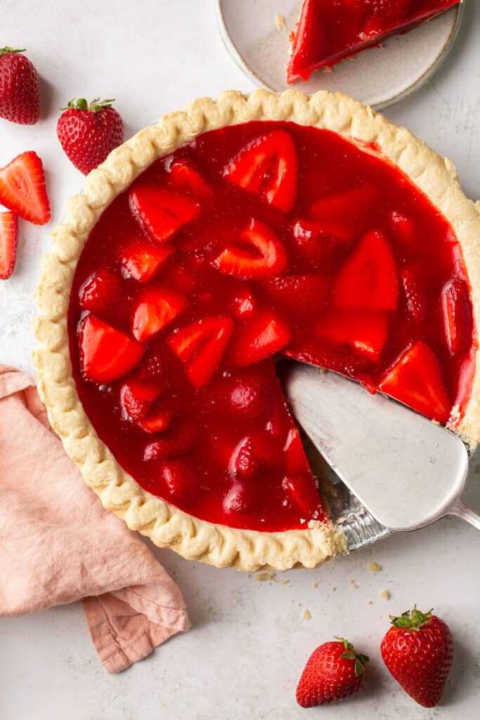 Strawberry pie with jello  being served.