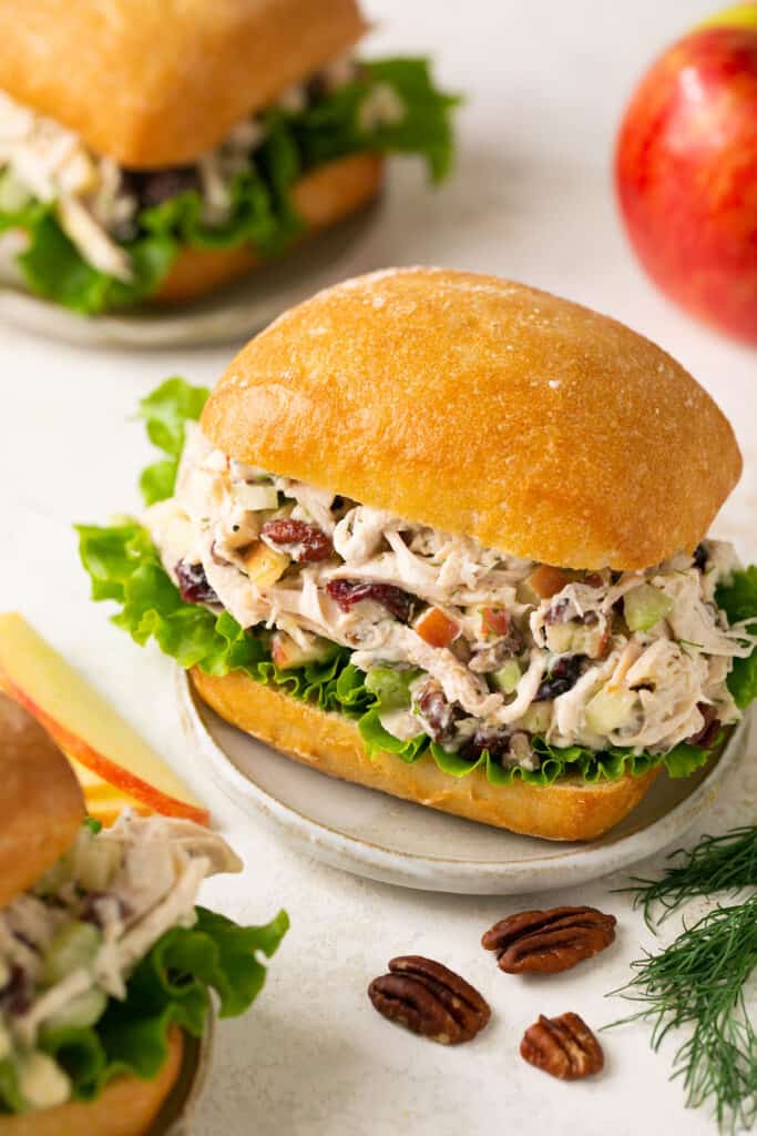 Easy apple pecan chicken salad recipe served on ciabetta bread dressed with lettuce.
