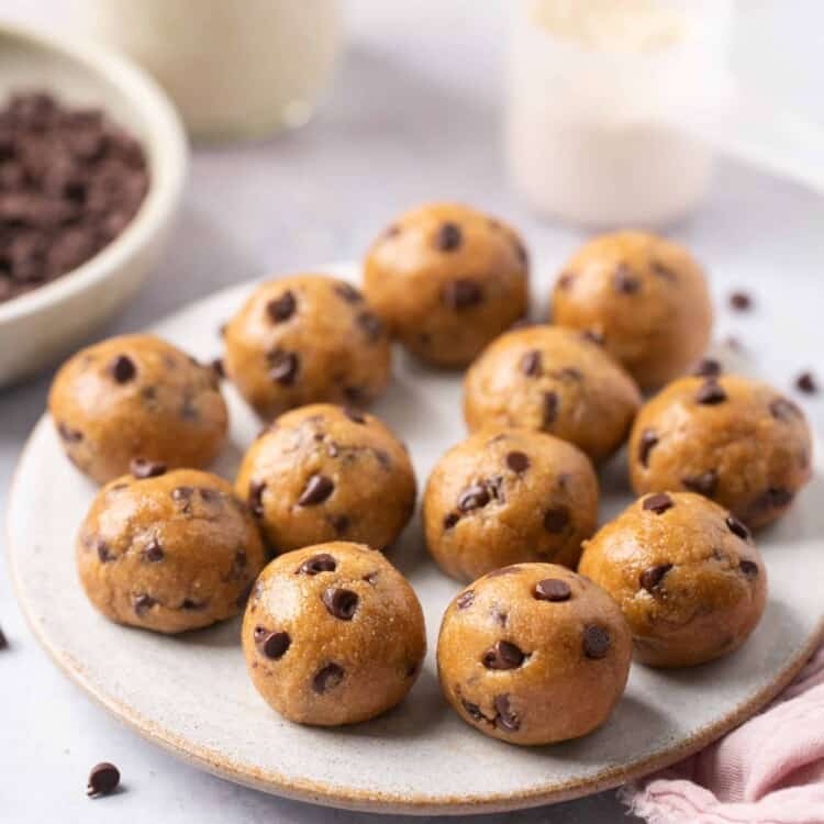 Cookie dough protein bites on a plate.