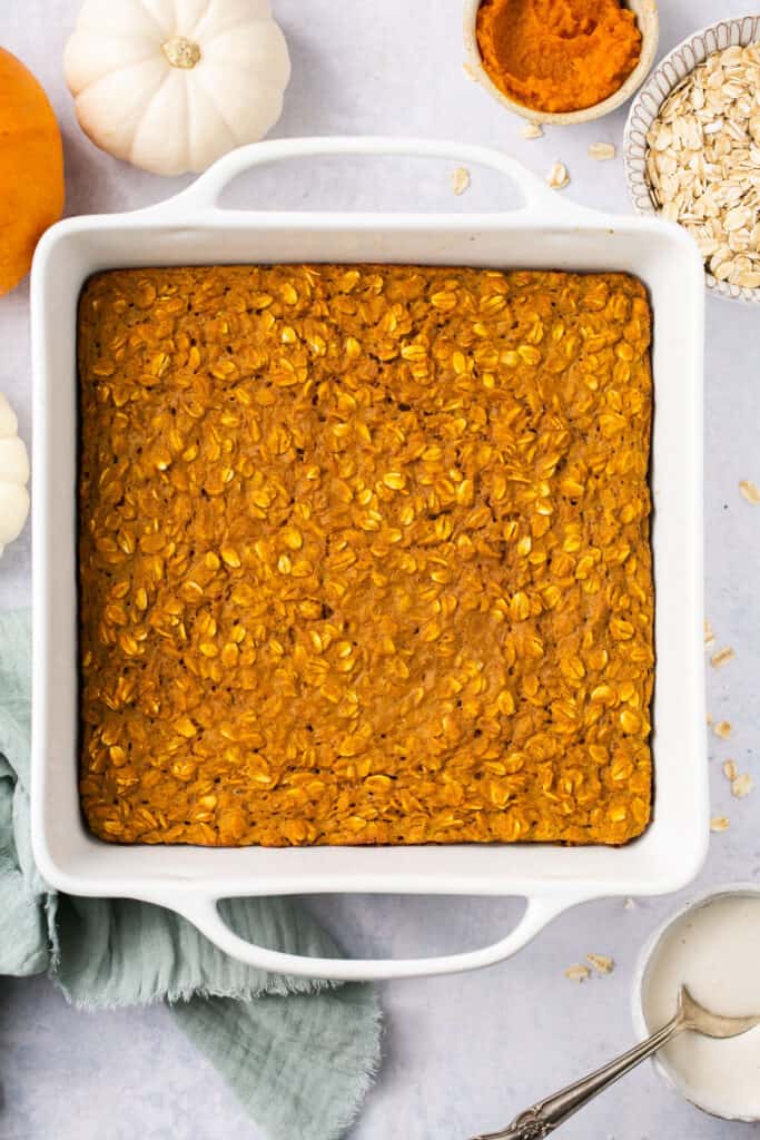 Healthy pumpkin oatmeal bake in a square baking dish after being baked.