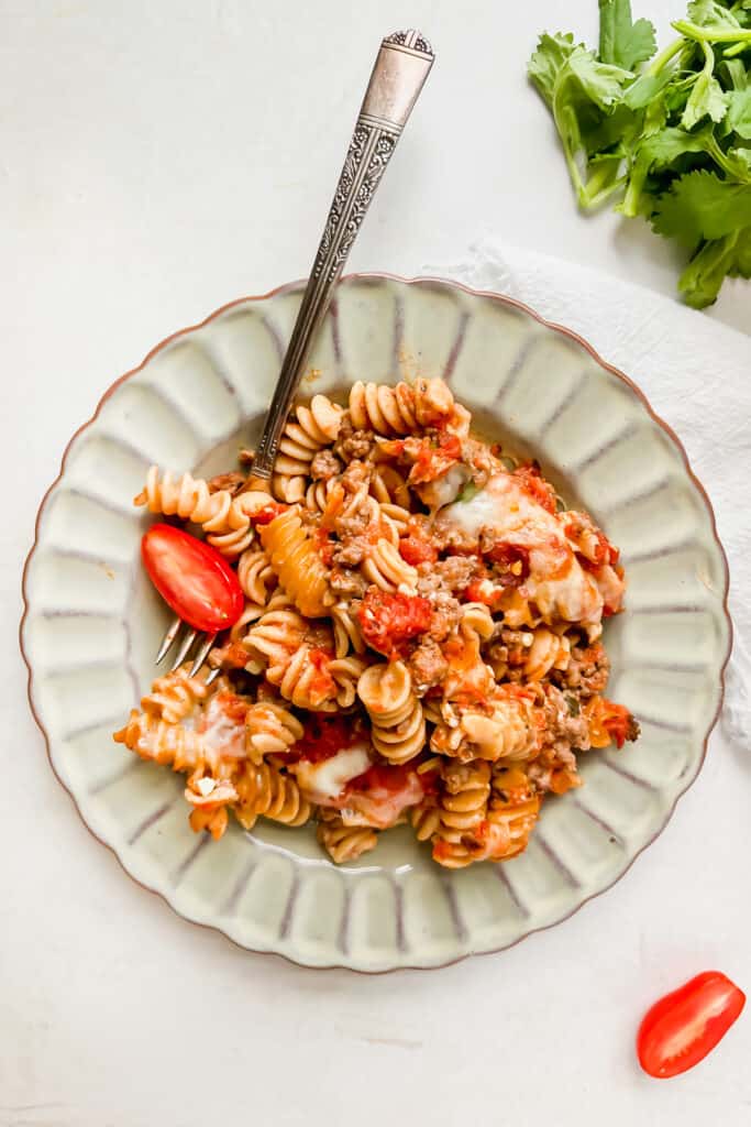 Rotini pasta bake on a plate with a fork