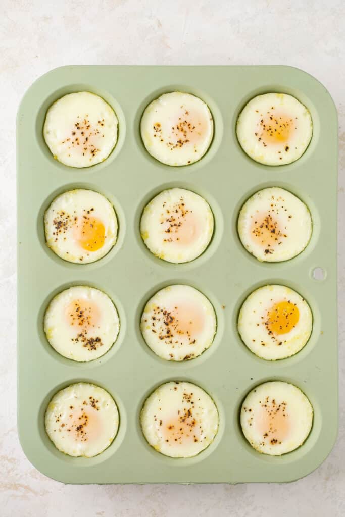 Cooked eggs in a muffin pan.
