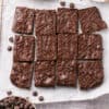 Healthy pumpkin brownies on parchment paper.