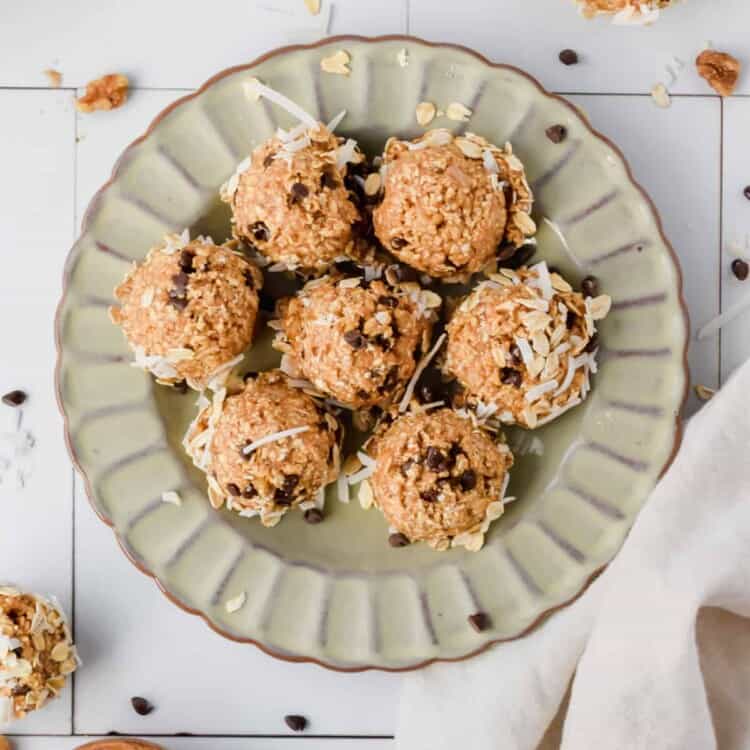 Oatmeal cashew cookie coconut protein balls on a serving plate.
