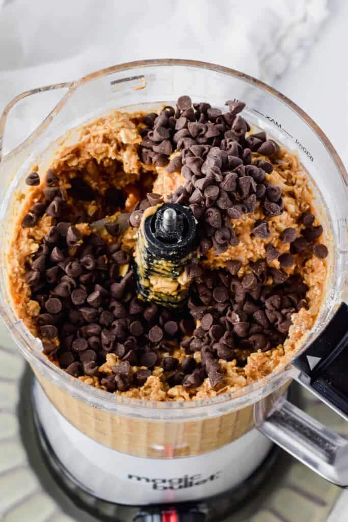 Chocolate chips added to the food processor of ingredients.