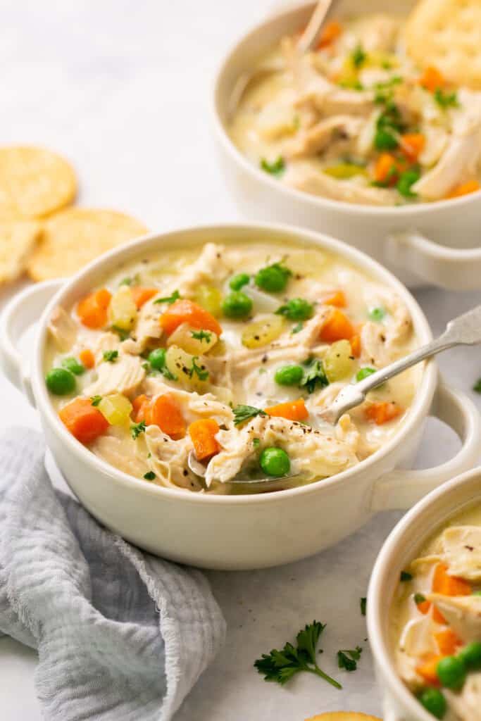 Chicken Pot Pie Soup in a bowl with a spoon