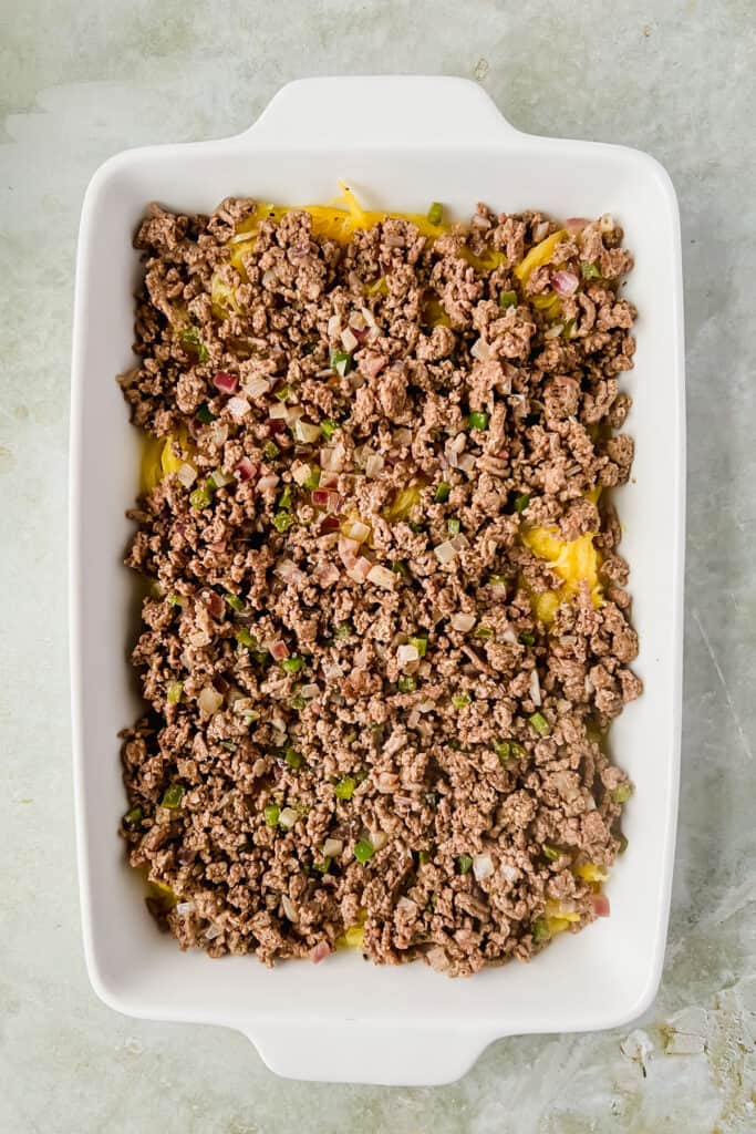 Cooked ground beef and spaghetti squash in a baking dish.