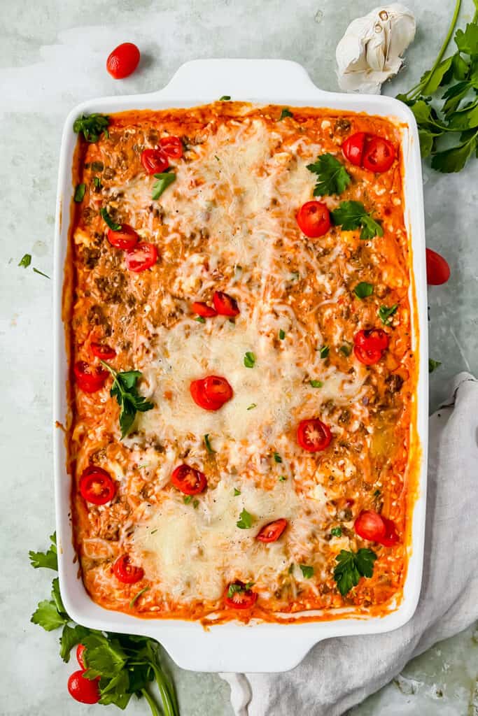 Baked spaghetti squash casserole in a baking dish after being baked.