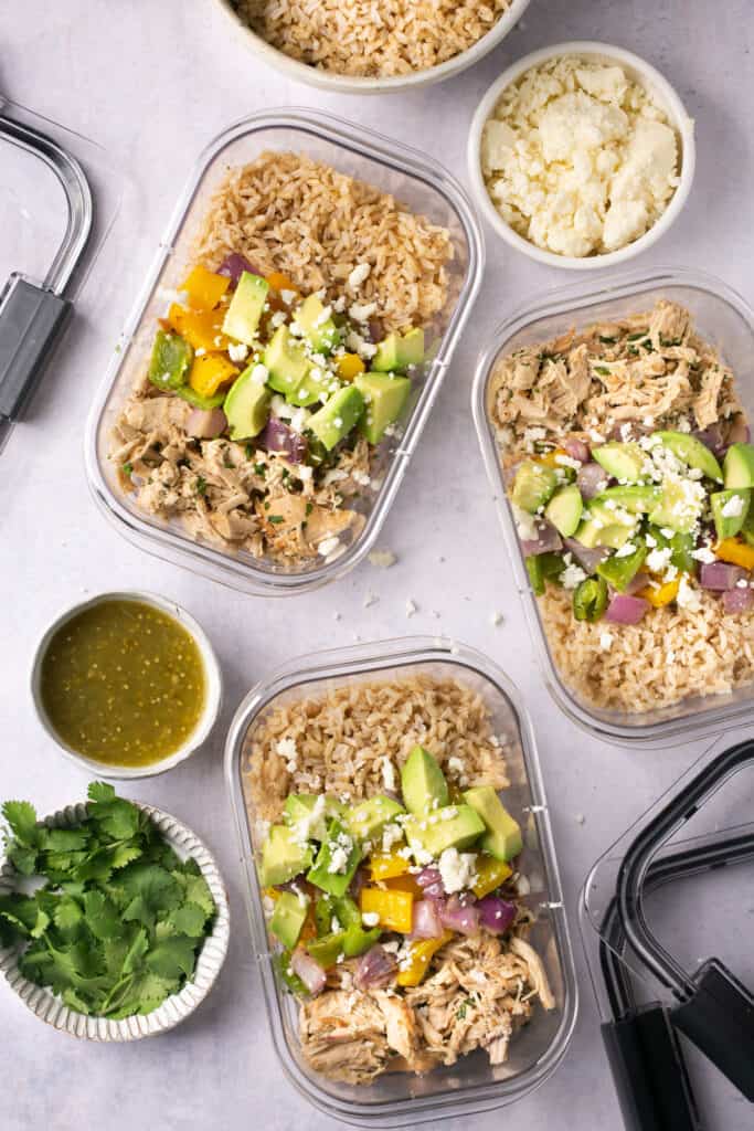 Salsa verde chicken bowls in glass meal prep containers