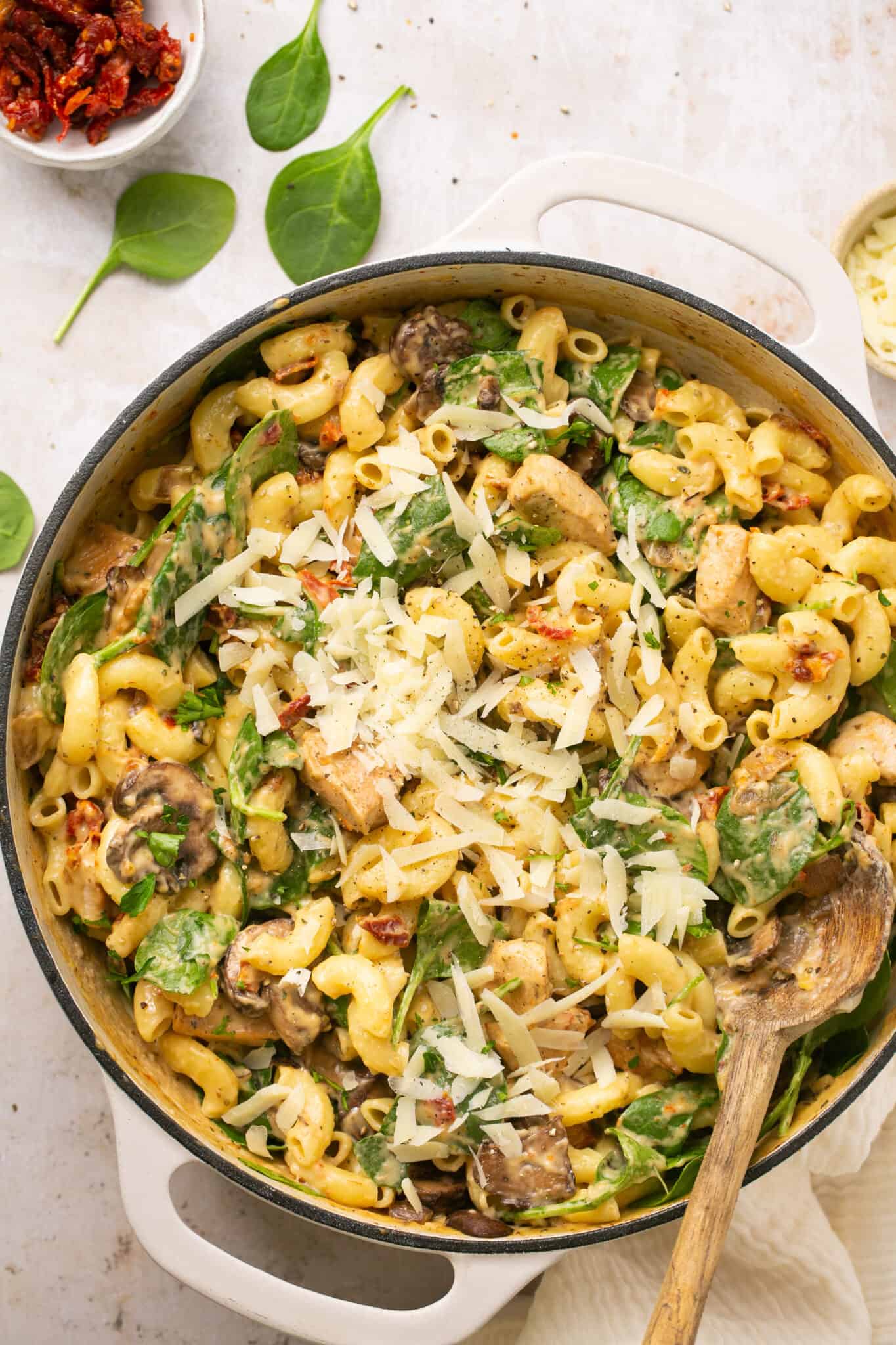 Tuscan chicken mac and cheese in a skillet.