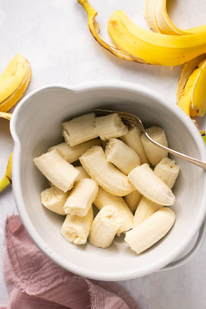 Banana pieces in a mixing bowl.