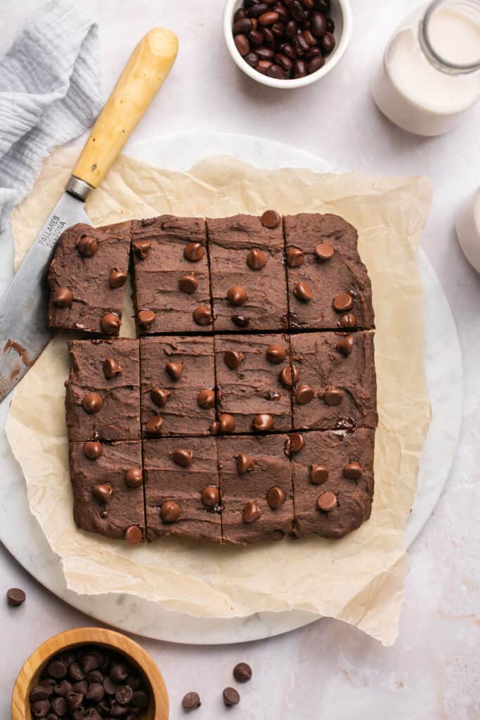 Black bean brownies on a tray with parchment paper.