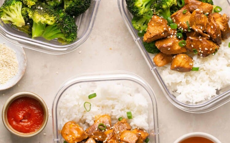 Honey sriracha chicken with rice and broccoli in meal prep containers.