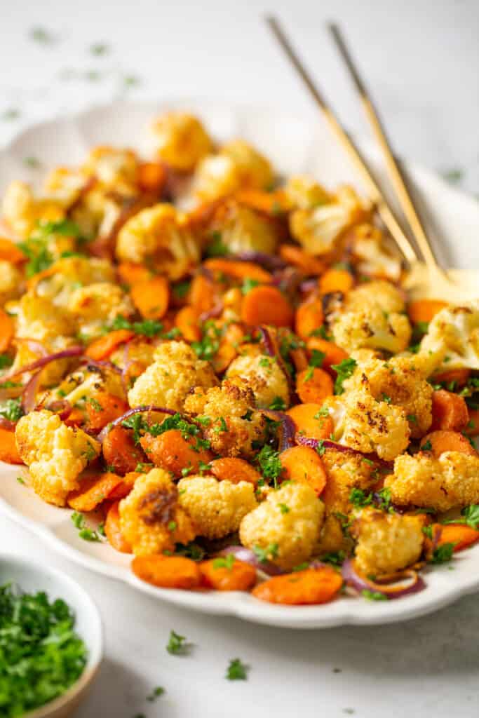 Roasted cauliflower and carrots in a serving dish