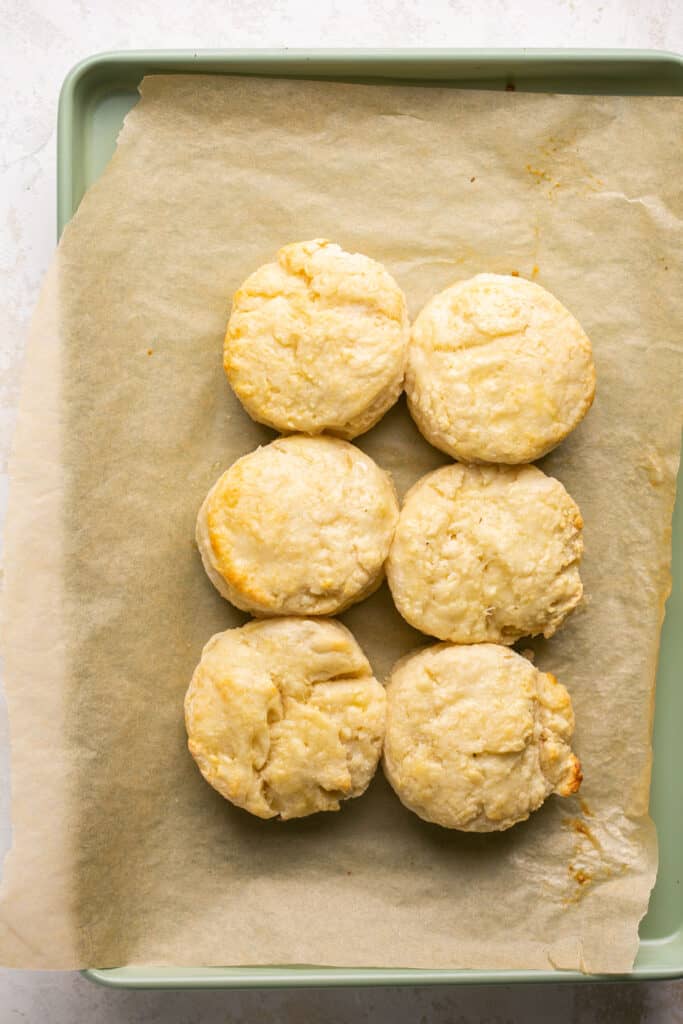 Greek yogurt biscuits on a baking sheet with parchment paper