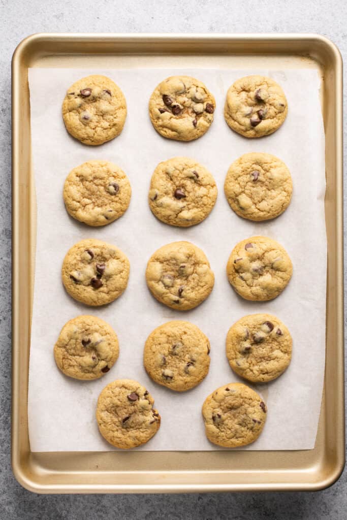 Small batch chocolate chip cookies on a baking sheet with parchment paper.