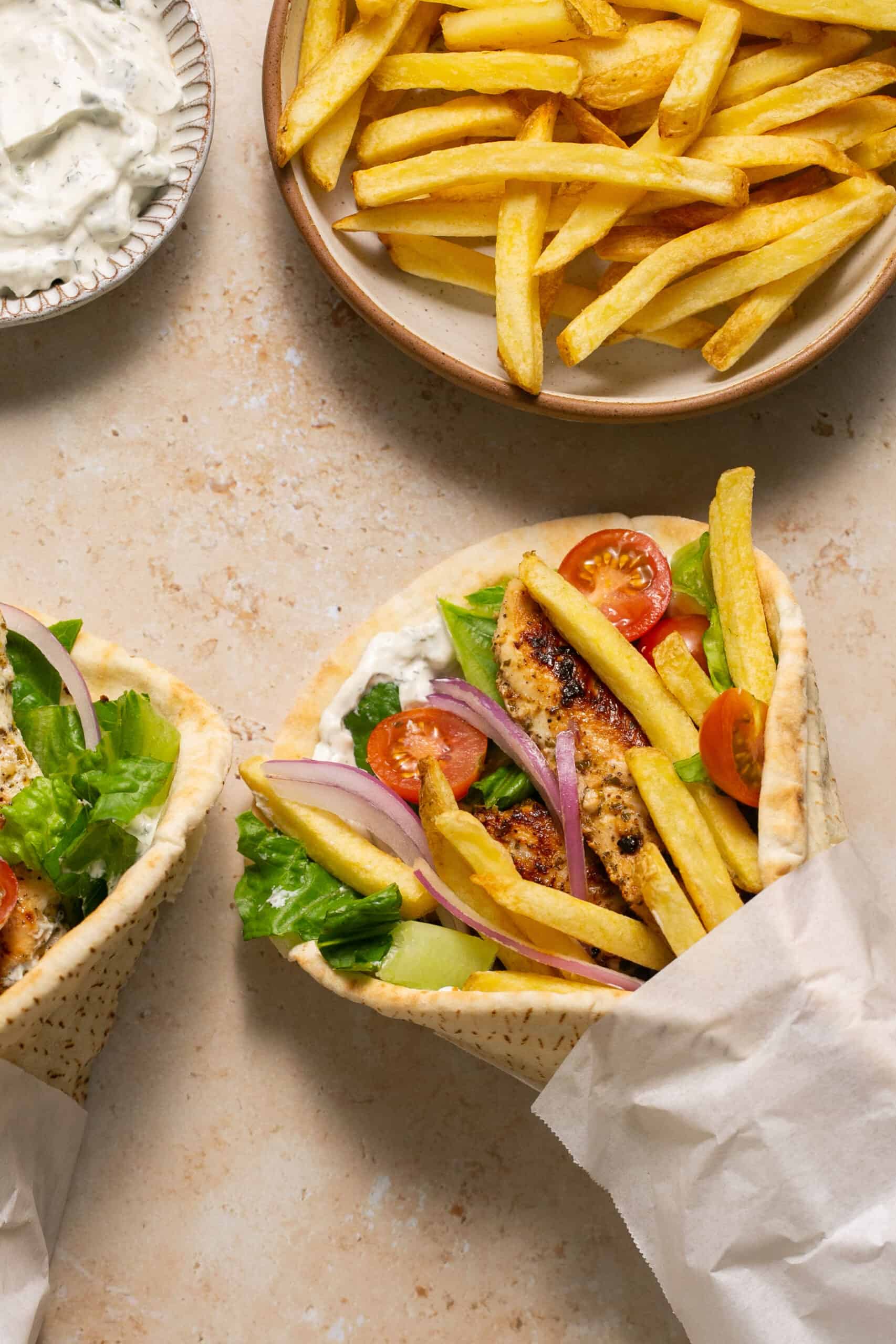 Healthy chicken gyro wrapped up with French fries.