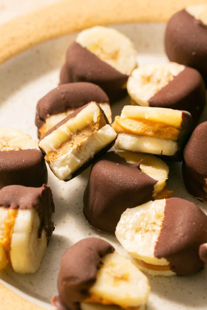 Zoomed in view of Frozen Chocolate Peanut Butter Banana Bites on a plate.