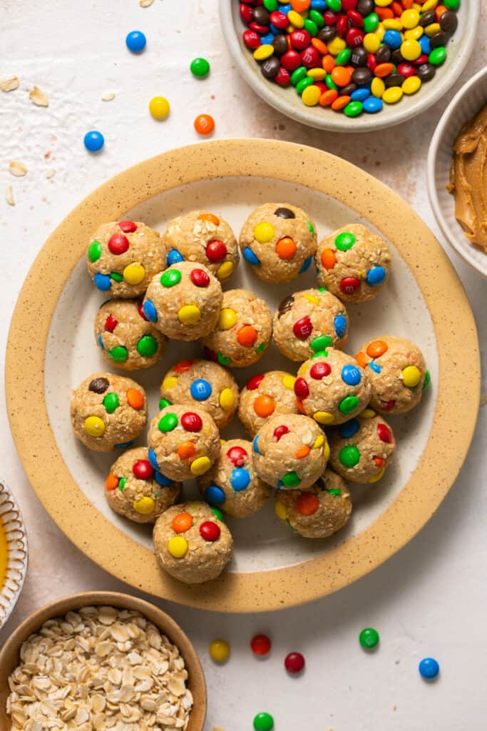 Monster cookie low calorie protein balls on a plate.