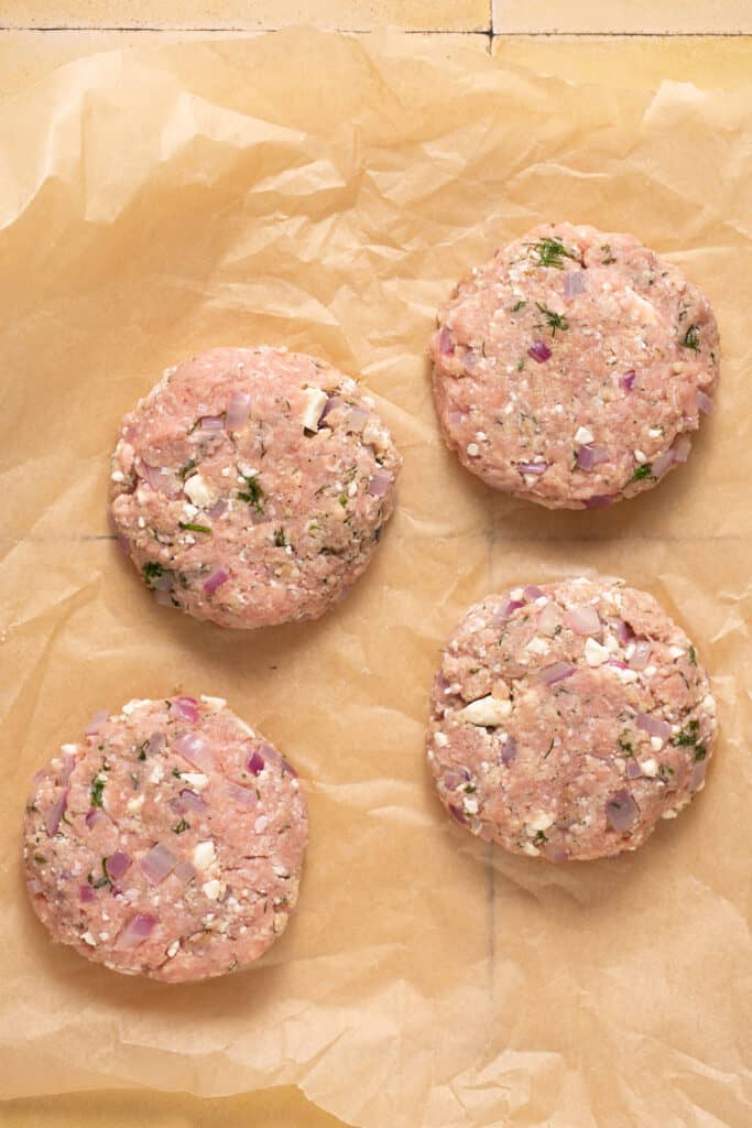 Air fryer turkey burgers formed into patties before being cooked.