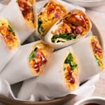 Several BBQ chicken wrap recipes cut in half.