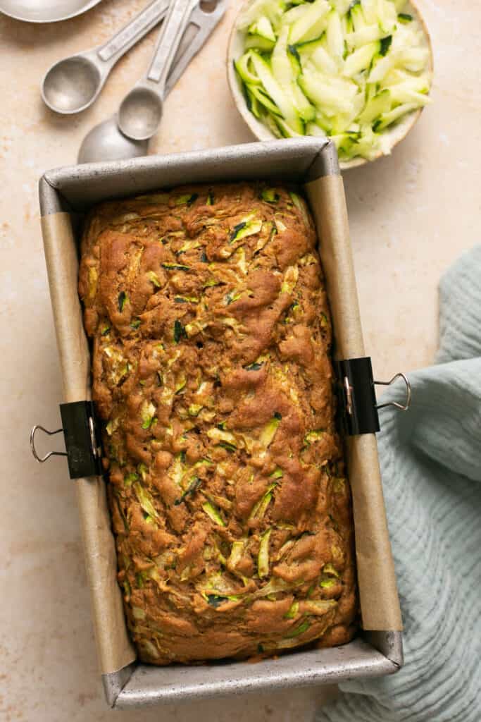 Healthy zucchini bread in a loaf pan after being baked.