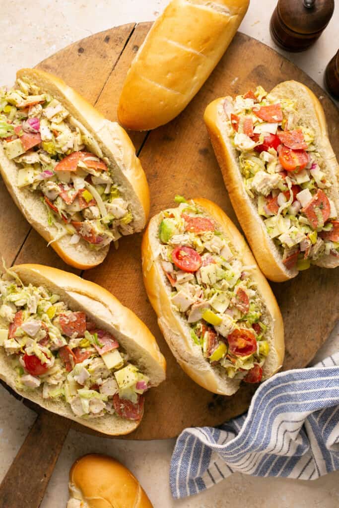 Chopped italian grinder salad recipe served on hoagies on a tray.